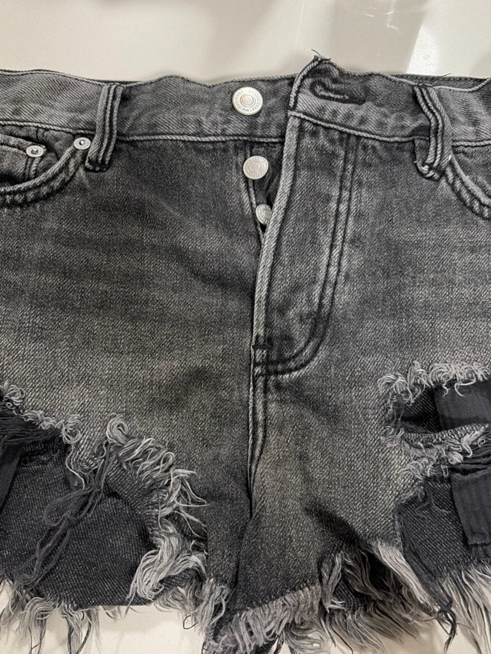 We The Free Washed Black Distressed Denim Shorts